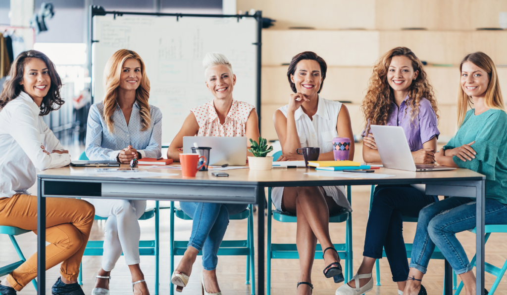 six women sitting in office and running a business : Let's Dive Deeper: How to Start These Businesses and Understand the Investment Needed : best business ideas for women : startup sutra